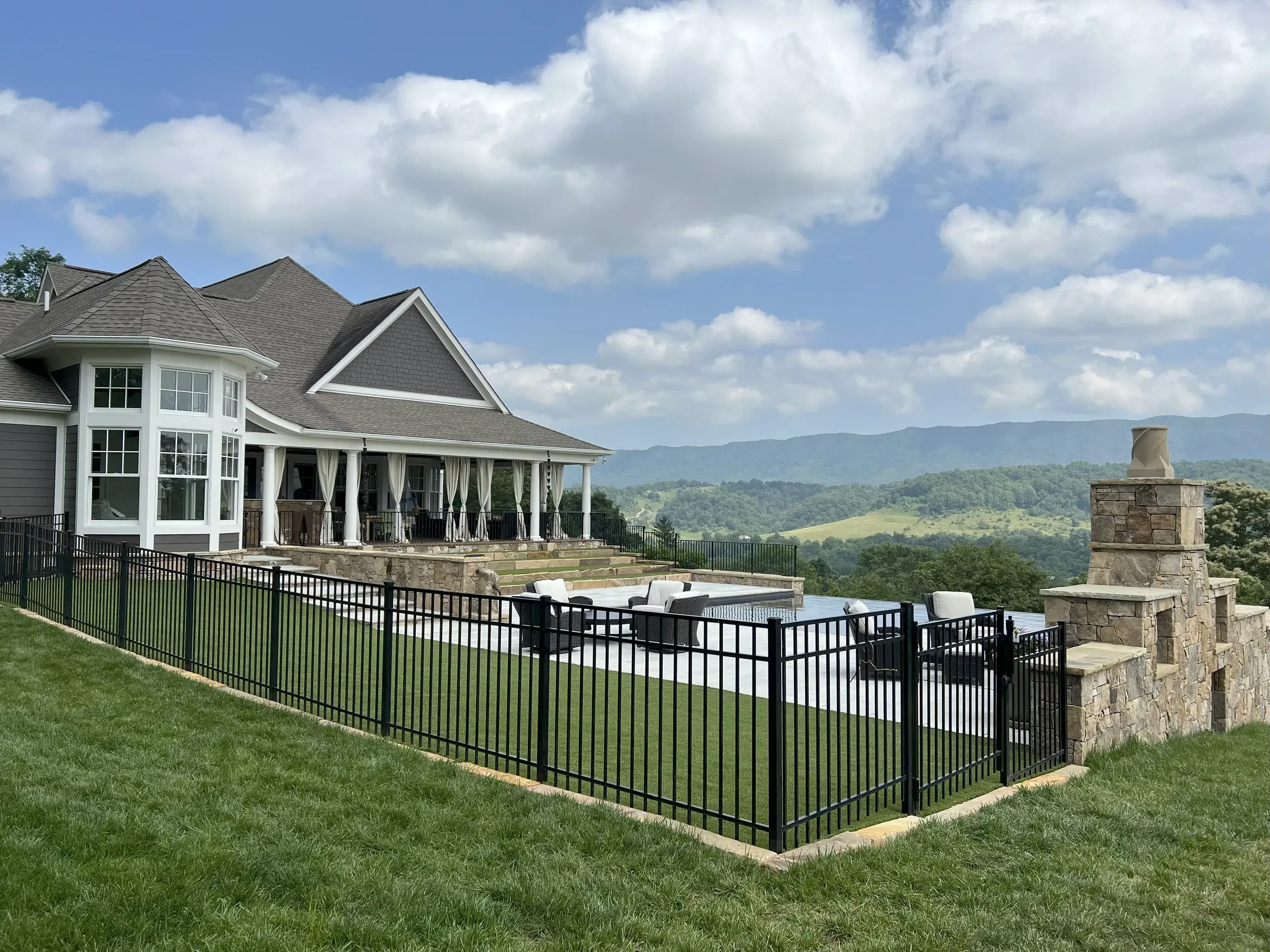 A house with a metal black fence