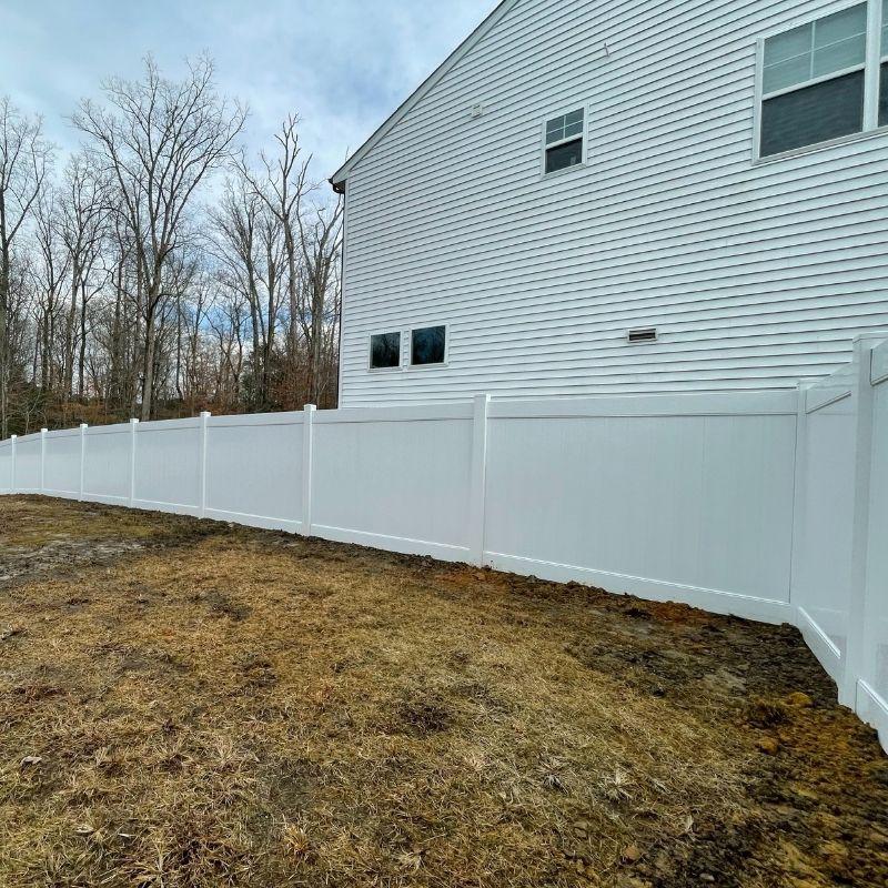 New vinyl fence installation by Top Rail Fence