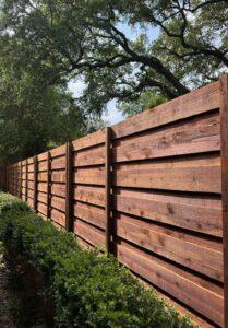Stained dark wood horizontal fence