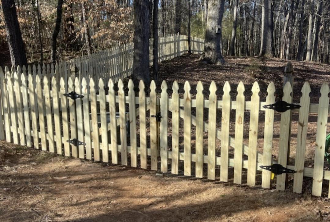 wood picket fence installed by top rail fence atlanta