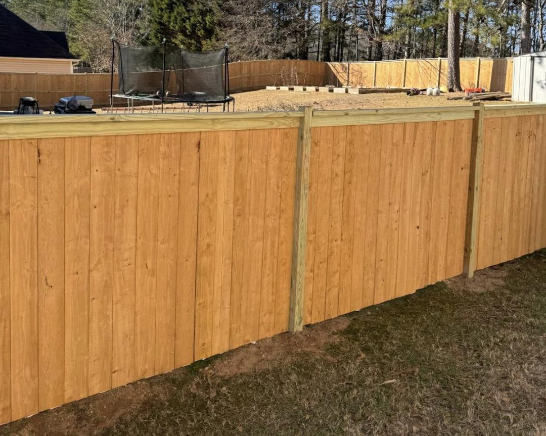 cap and trim fence installed by top rail fence atlanta