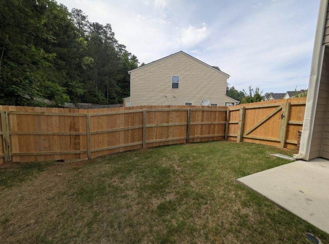 stockade fence installed by top rail fence atlanta