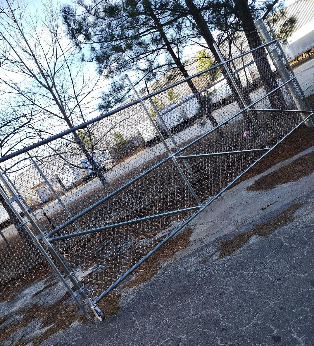rolling chain link gate installed by top rail fence atlanta