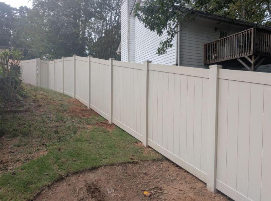 tan privacy fence installed by top rail fence atlanta