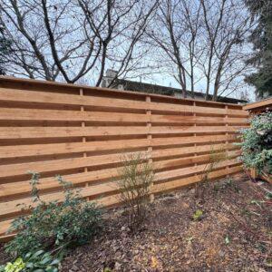 Horizontal wood fence installed by Top Rail Fence