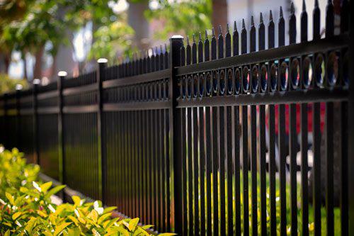 Smooth-top metal fence with spear pickets by Top Rail Fence
