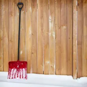 snow shovel wood fence winter maintenance