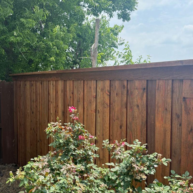 6-foot board-on-board fence with cap and trim installed by Top Rail Fence