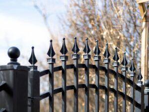 Staggered spear top wrought iron fence