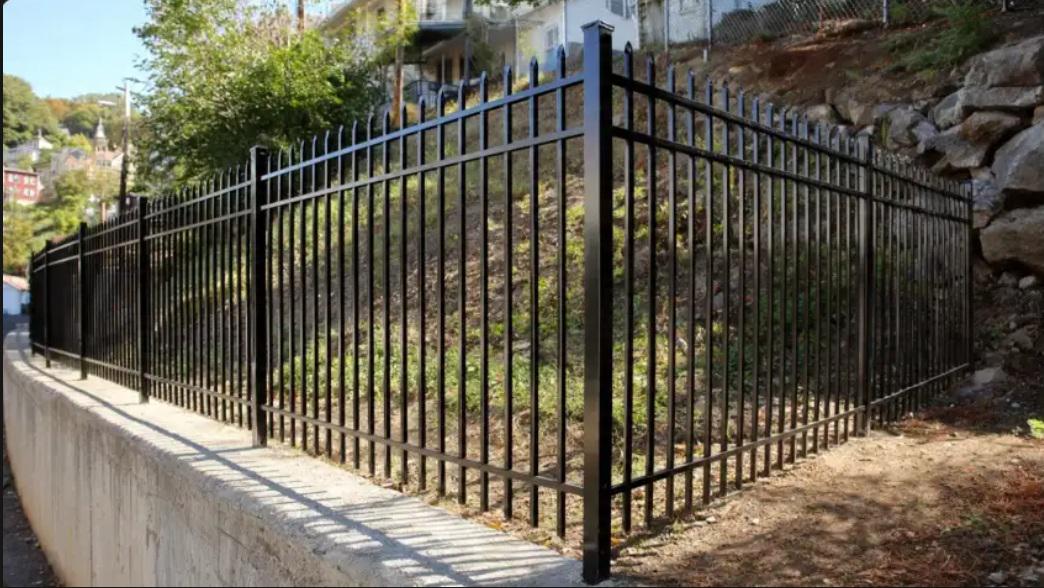 How metal fencing lines interact with Hartford’s sloped urban properties