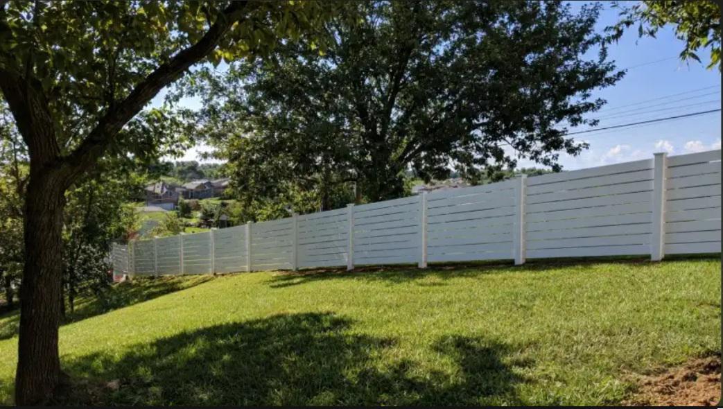 How Louisville yard elevation shapes the visual flow of vinyl fencing installations