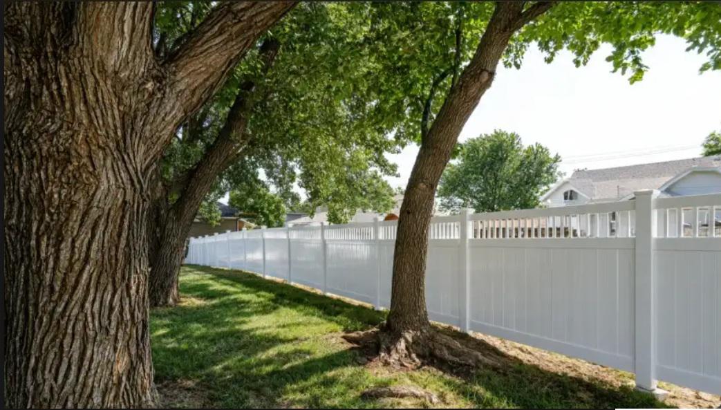 What a fence company in Omaha considers before designing around mature tree coverage