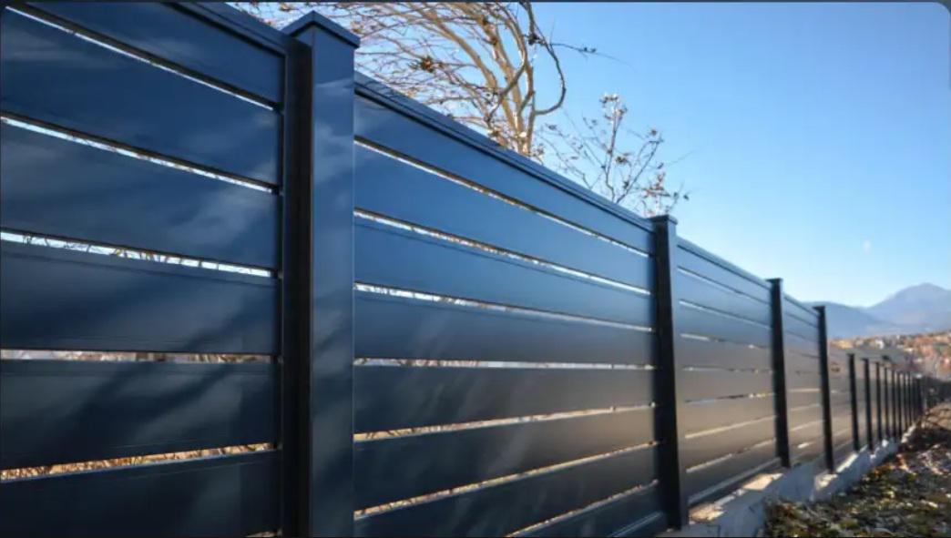 Why is metal fencing in Colorado Springs often installed after one unexpected wind event