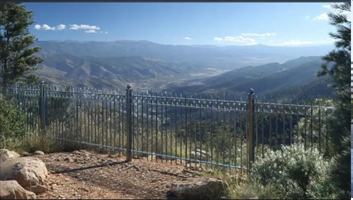 Can a metal fence change how you experience elevation? a Colorado Springs property challenge