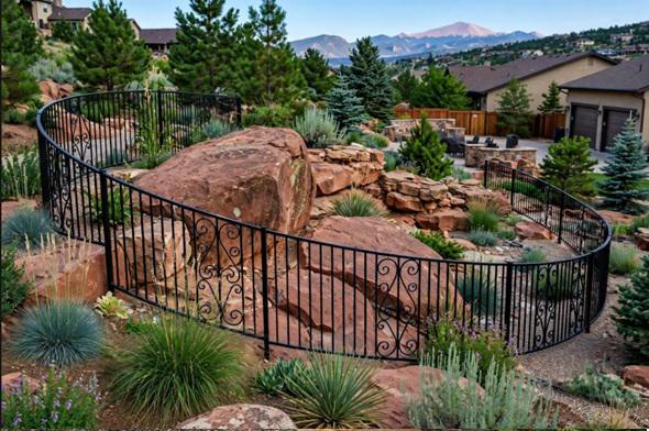 Designing metal fencing around the natural rock features found in Colorado Springs yards