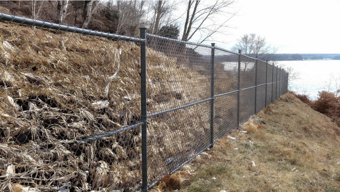 How Chain Link Fencing in Louisville Performs on Sloped Yards Near the Ohio River