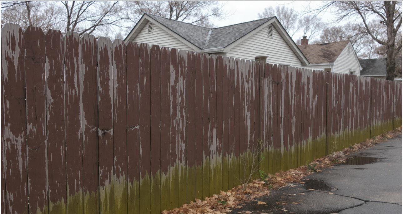How does a wood fence in Northern Detroit age alongside your home and habits over time?