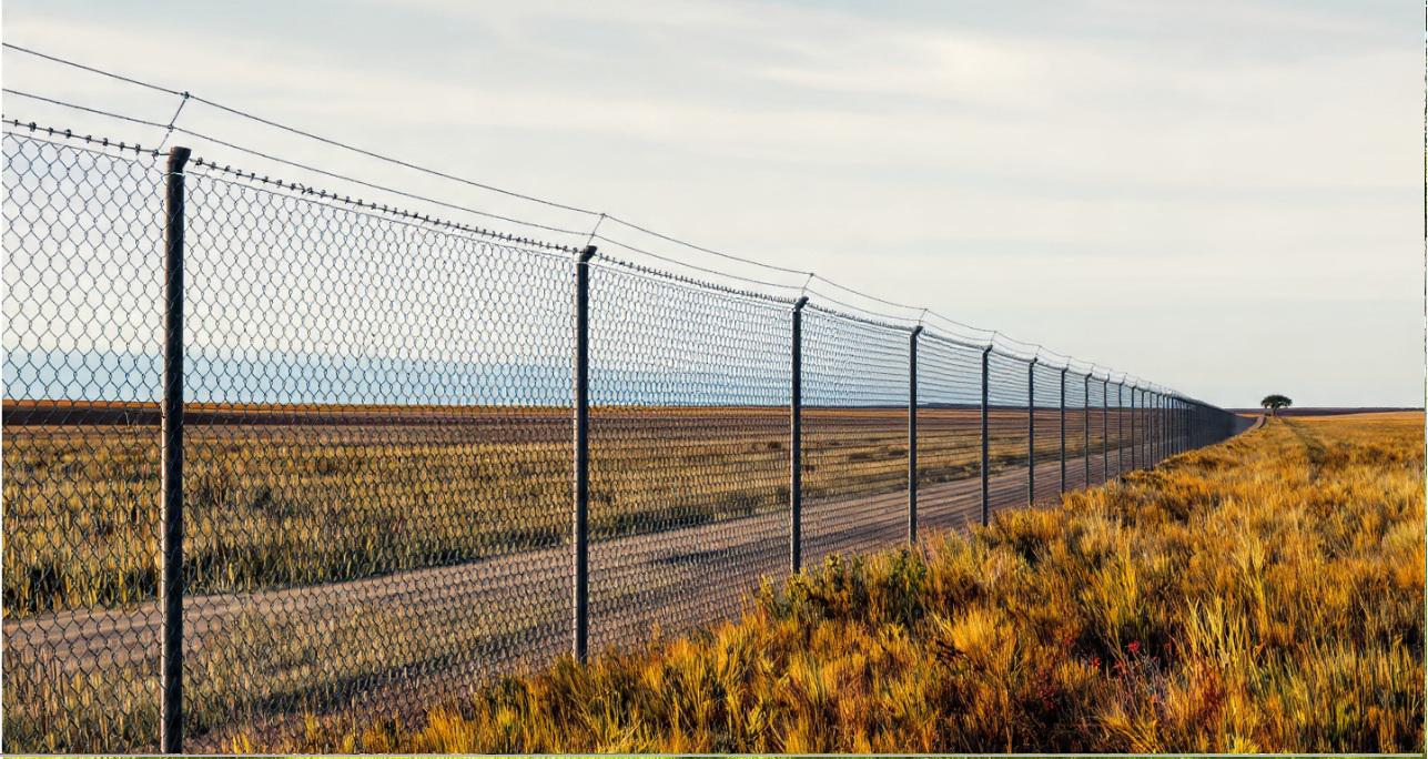 Metal fencing across the Texas Panhandle and its role in defining boundaries without blocking horizons
