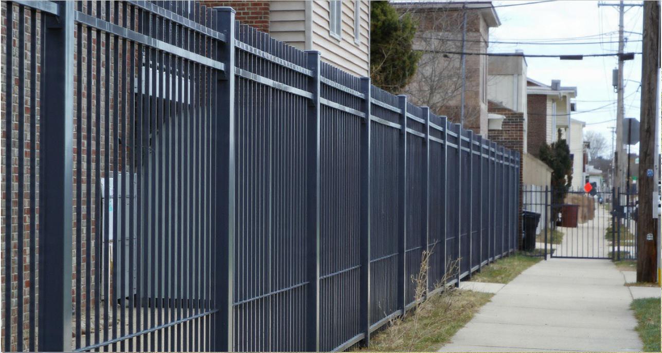 How metal fencing frames movement and access points across Wilmington properties