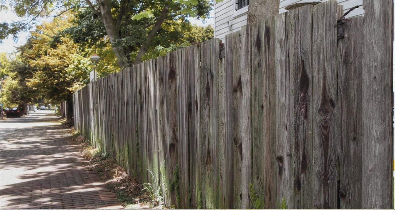 Wood fencing in Wilmington as a material that absorbs the environment and reflects local character