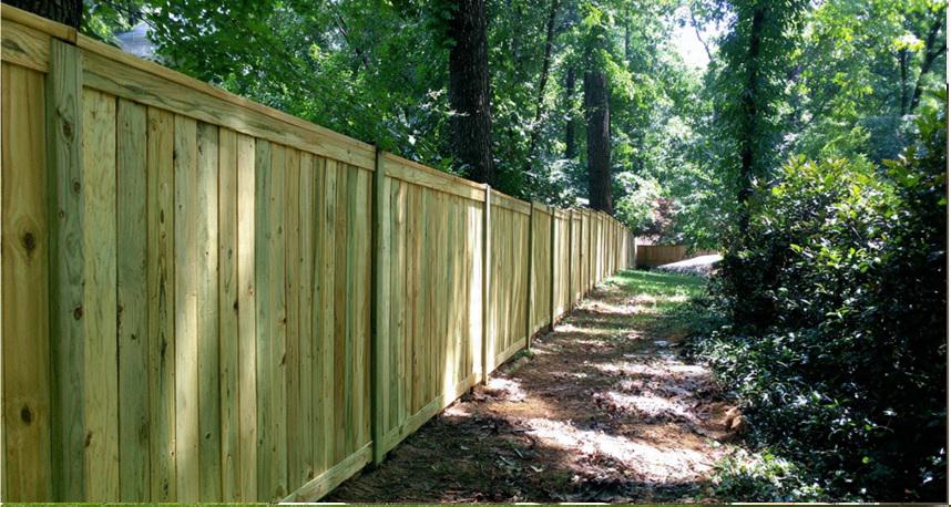 Wood fencing in Atlanta as a material that adapts to tree cover, moisture, and shifting shade lines
