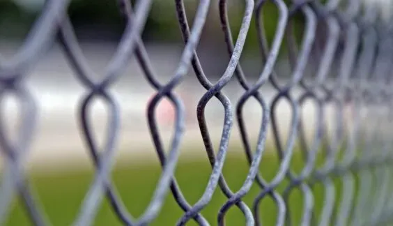 Close-up view of a galvanized chain link fence 