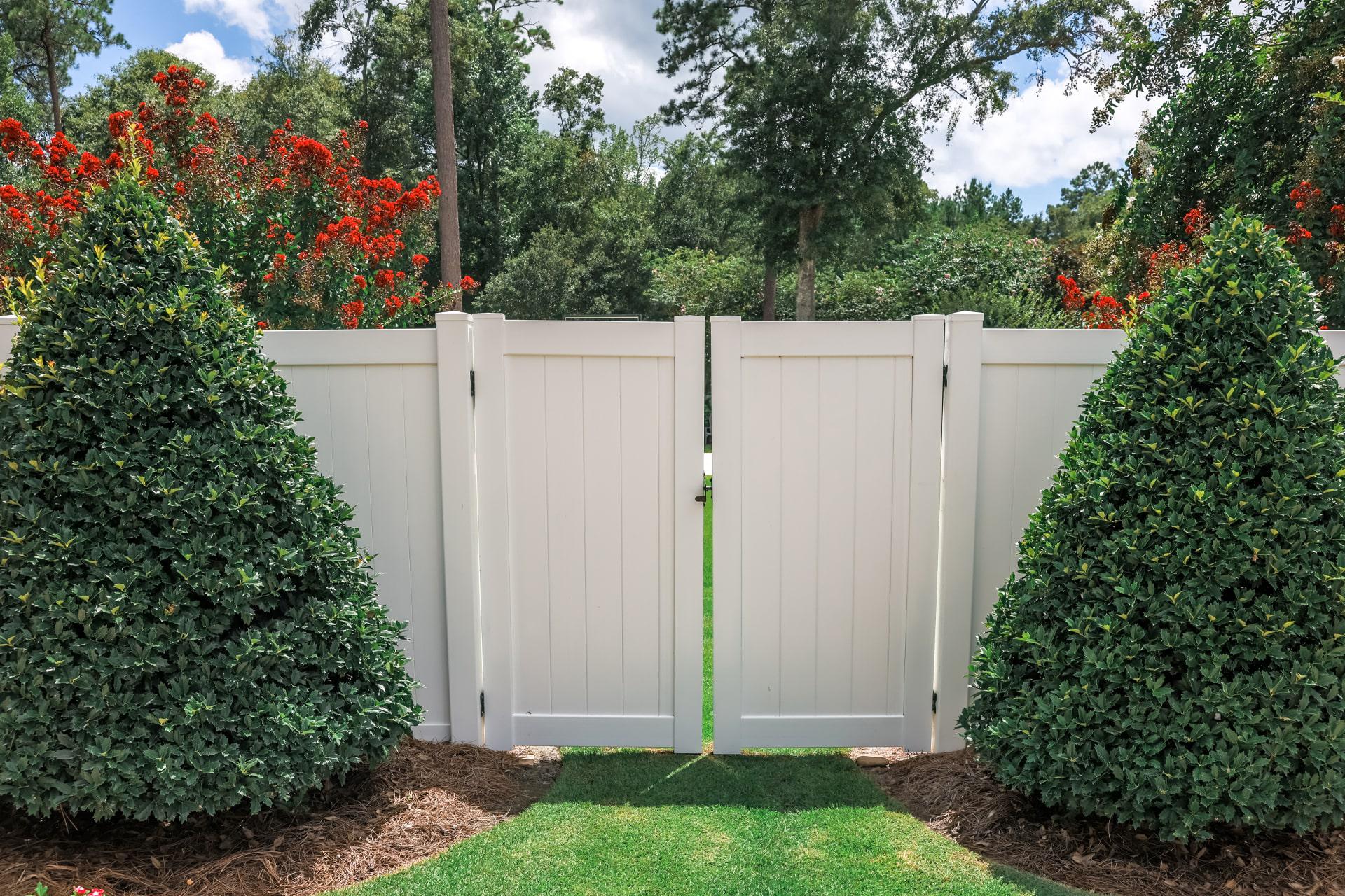 Vinyl double swing gate by Top Rail Fence