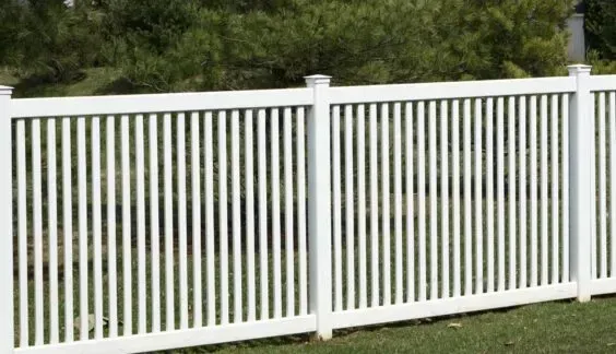 Closed picket vinyl fence by Top Rail Fence