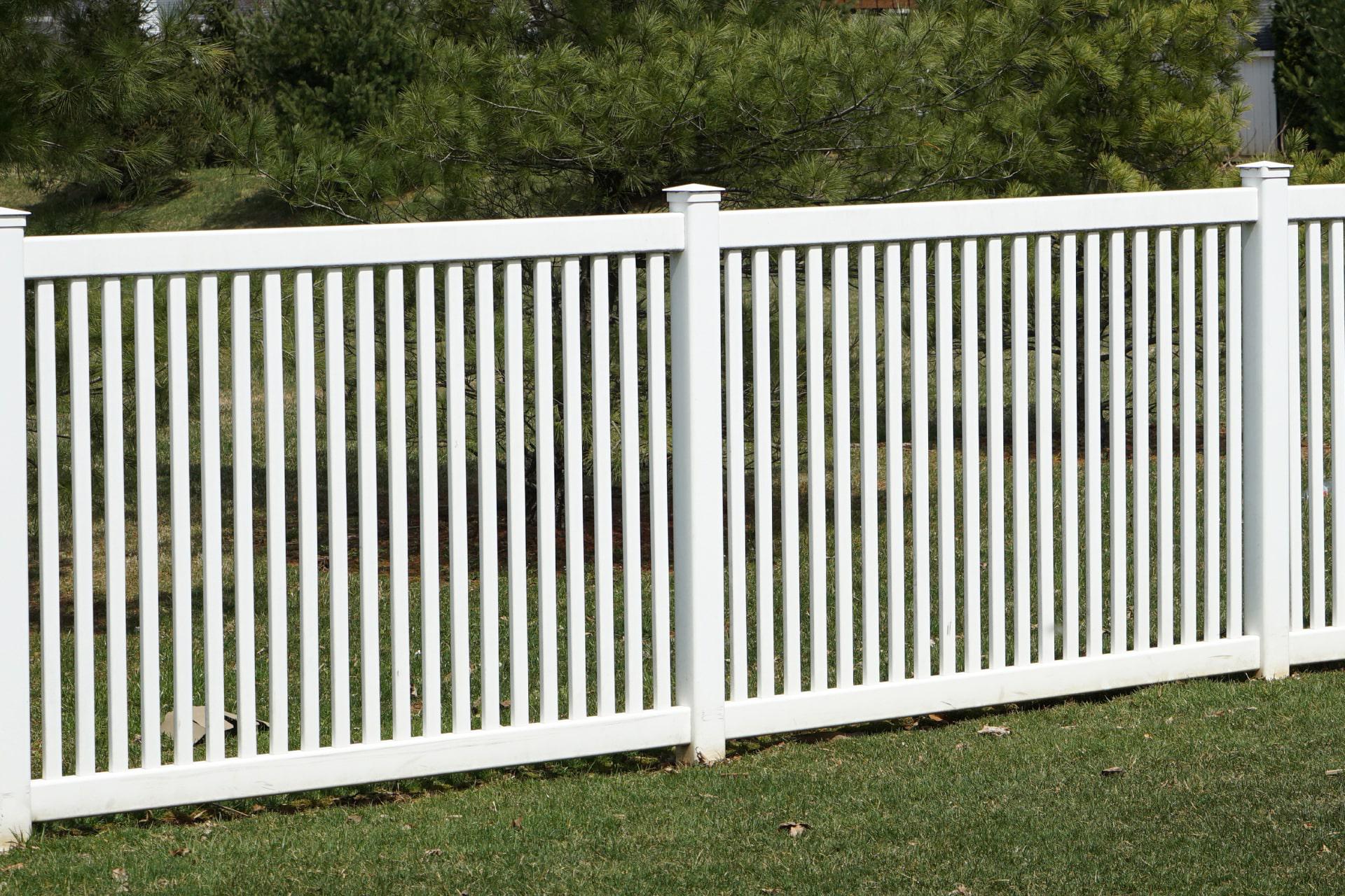 Closed picket vinyl fence by Top Rail Fence