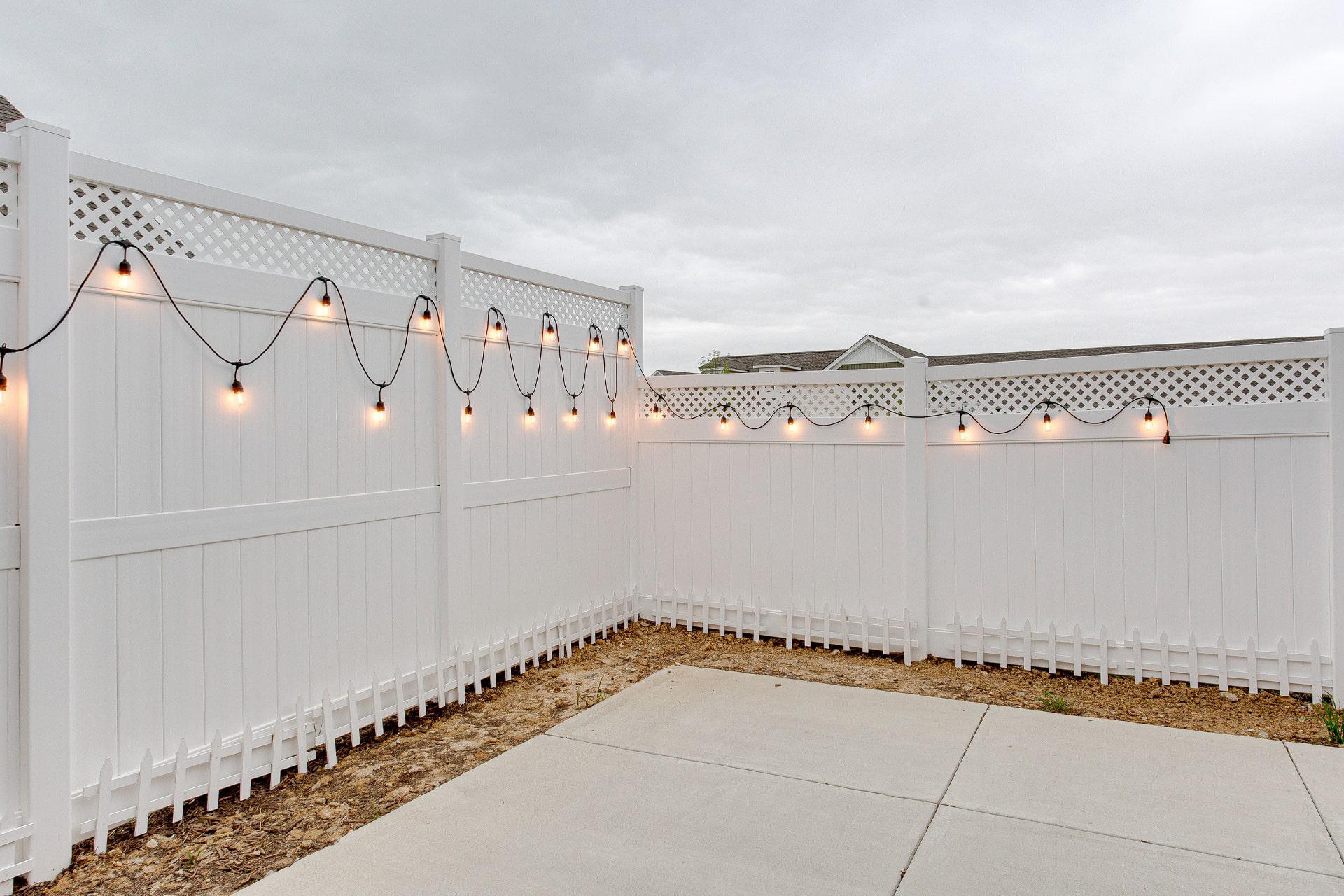 Lattice-top solid privacy vinyl fence by Top Rail Fence