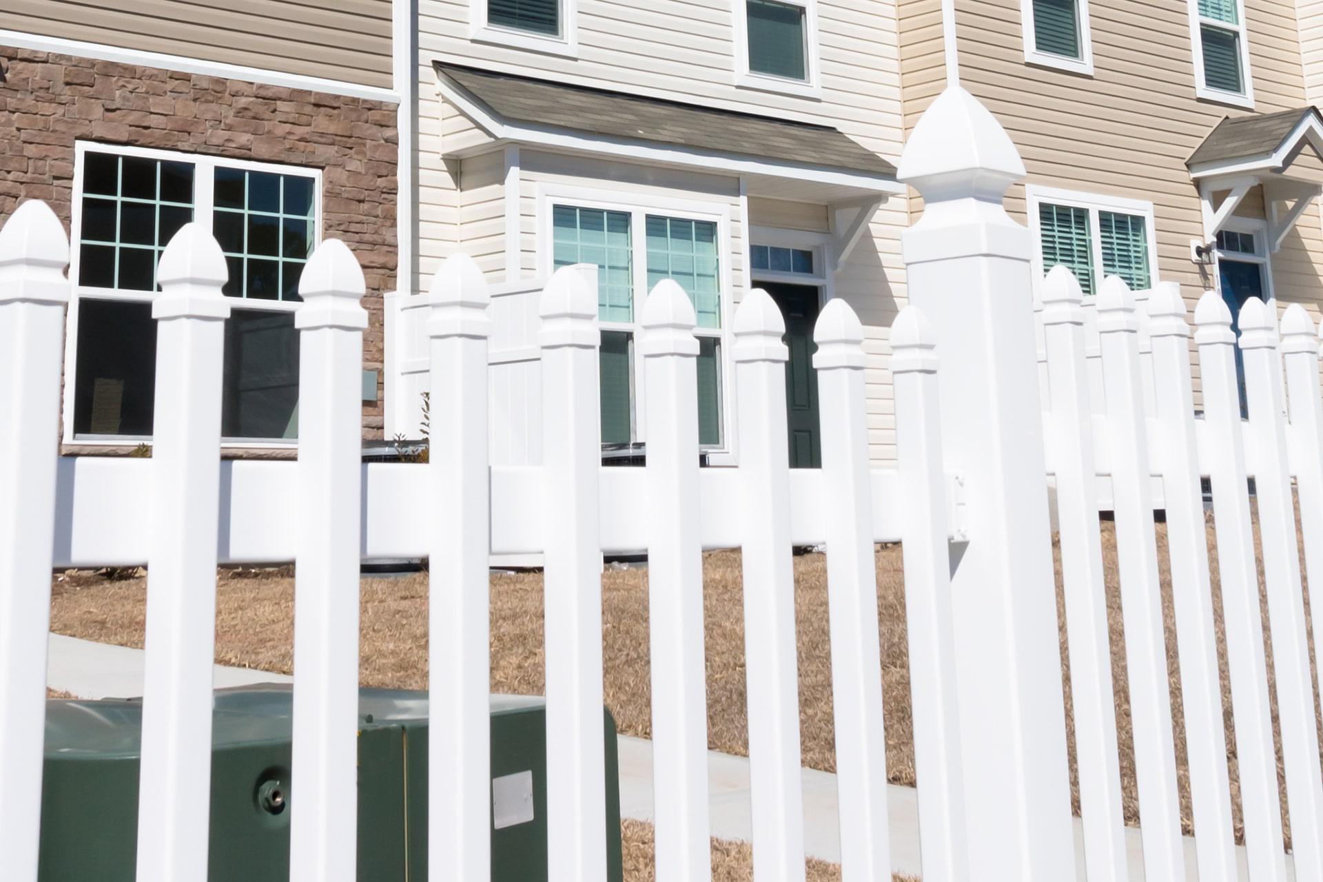 Spade picket vinyl fence by Top Rail Fence