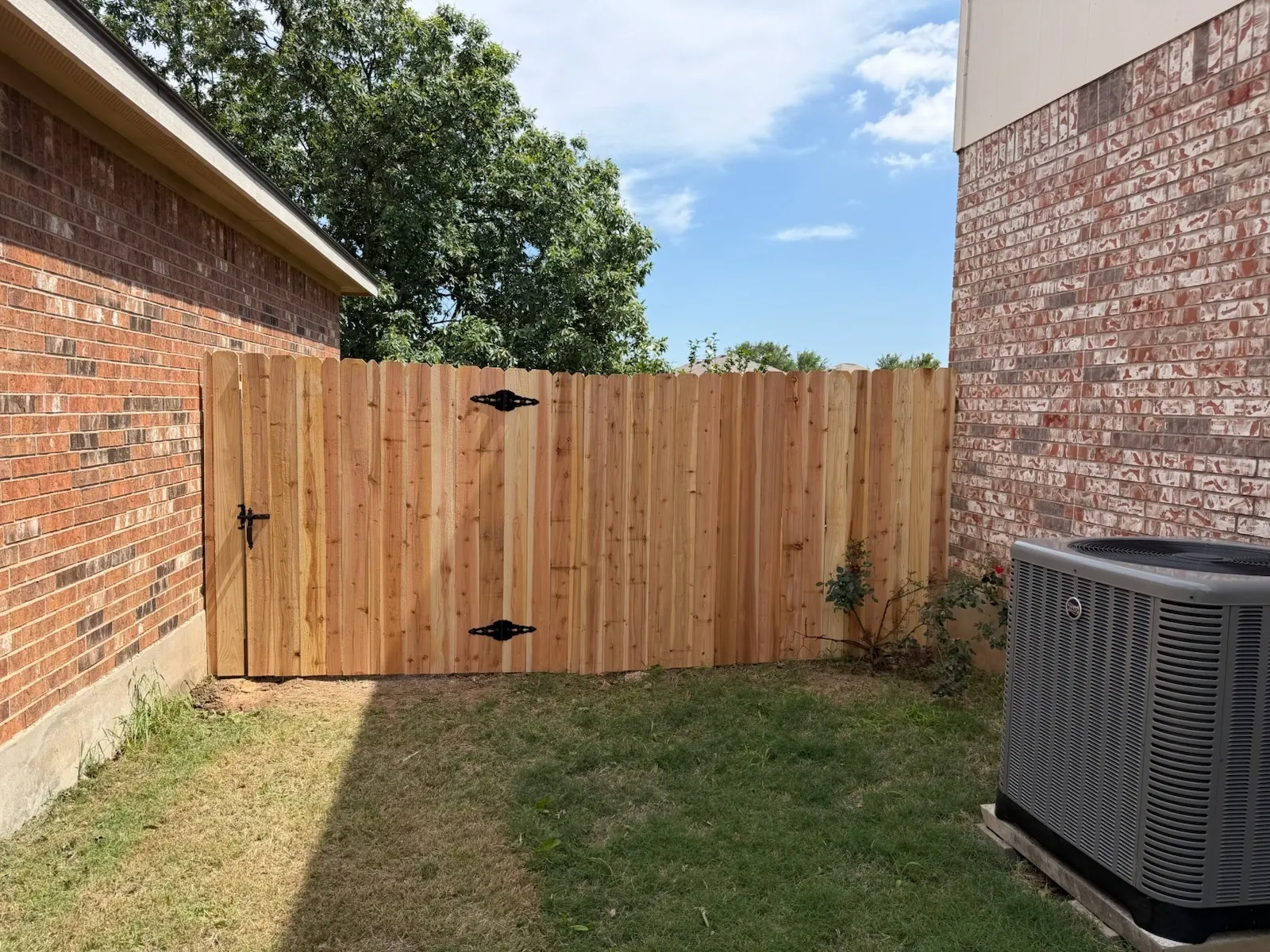 wood stockade fence installed by top rail fence