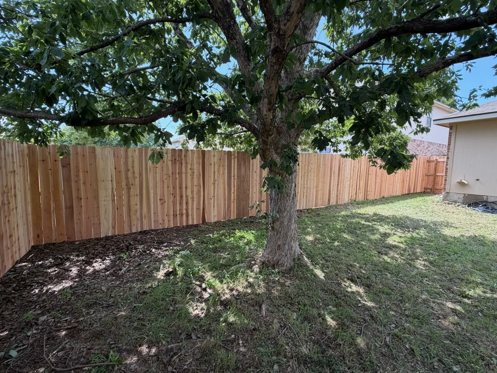 wood stockade fence installed by top rail fence