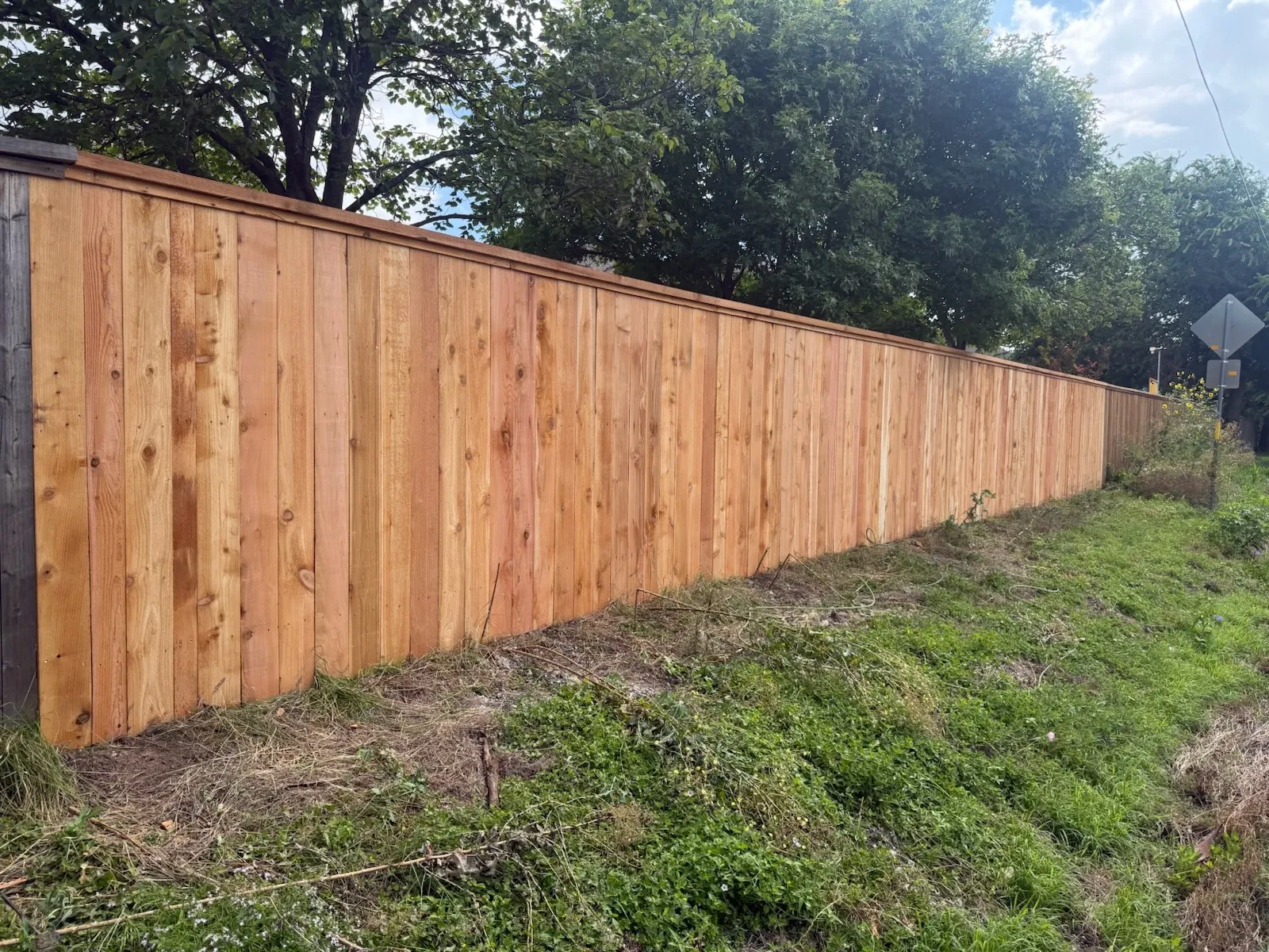 wood stockade fence installed by top rail fence