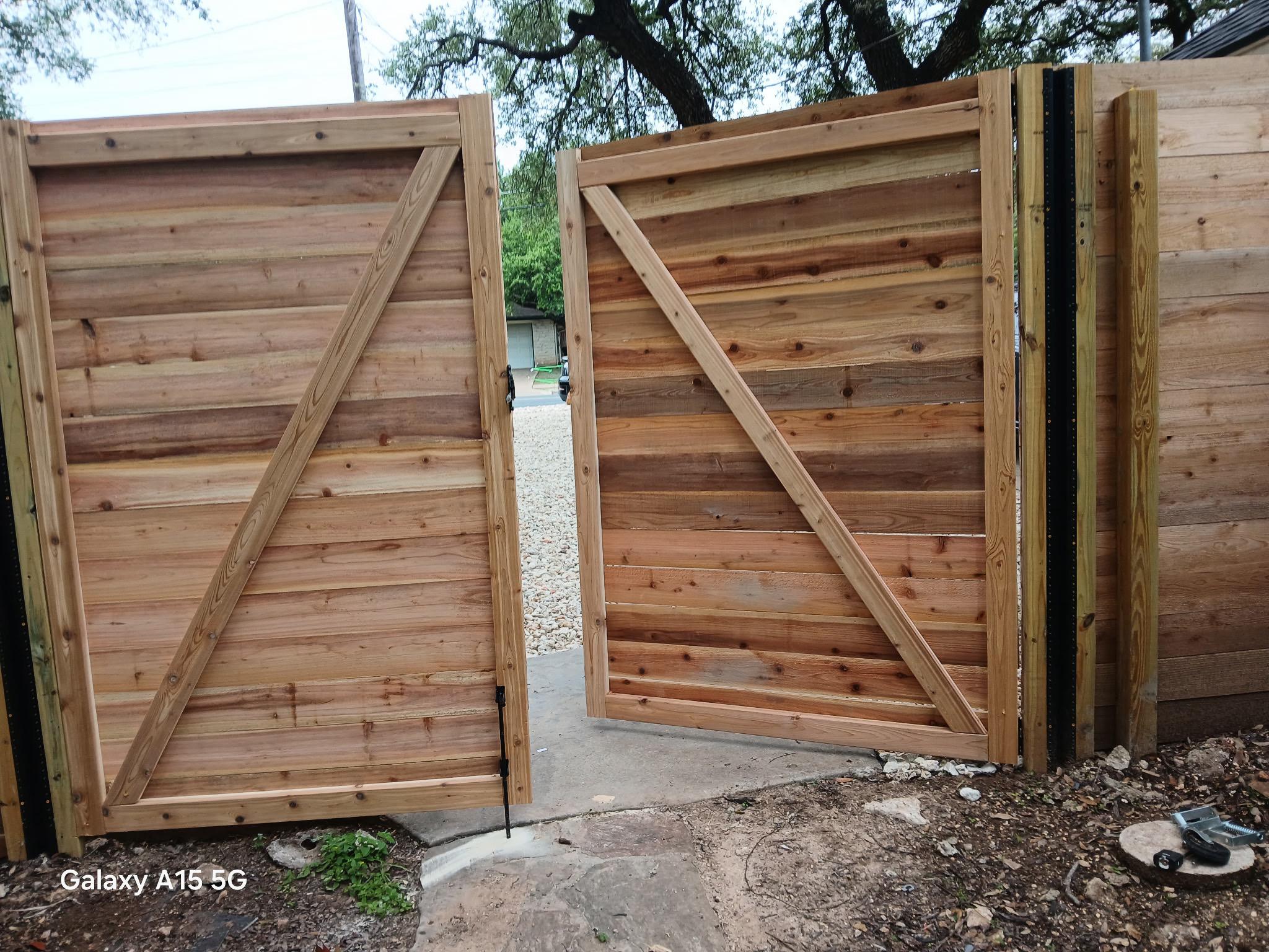 wood horizontal fence installed by top rail fence