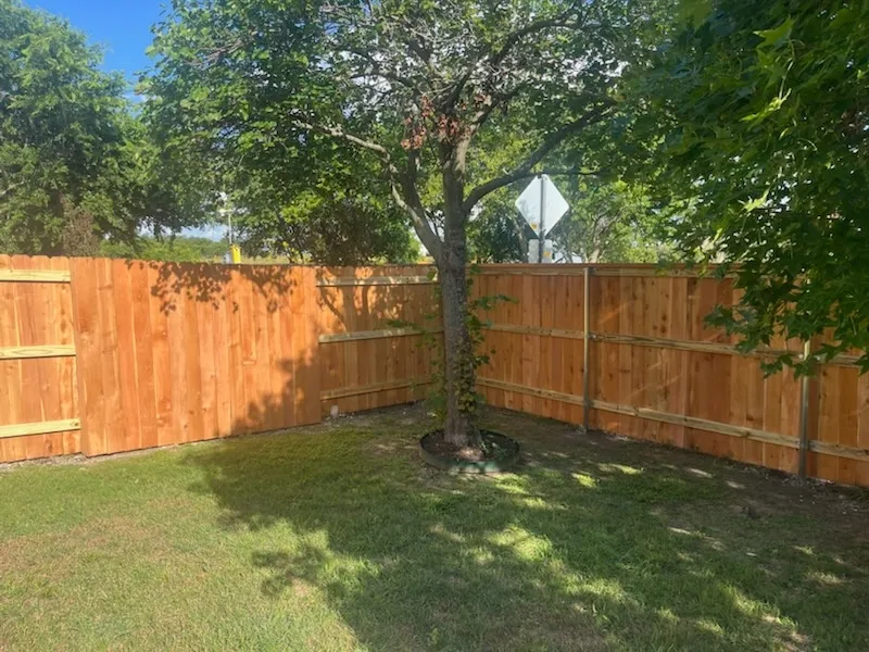 wood good neighbor fence installed by top rail fence
