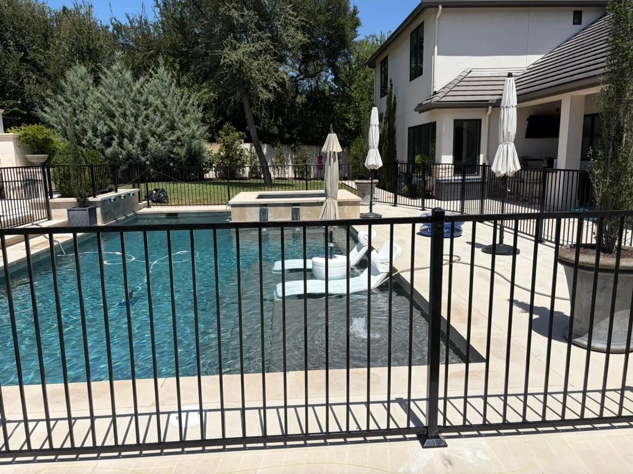 two rail ornamental metal fence installed by top rail fence