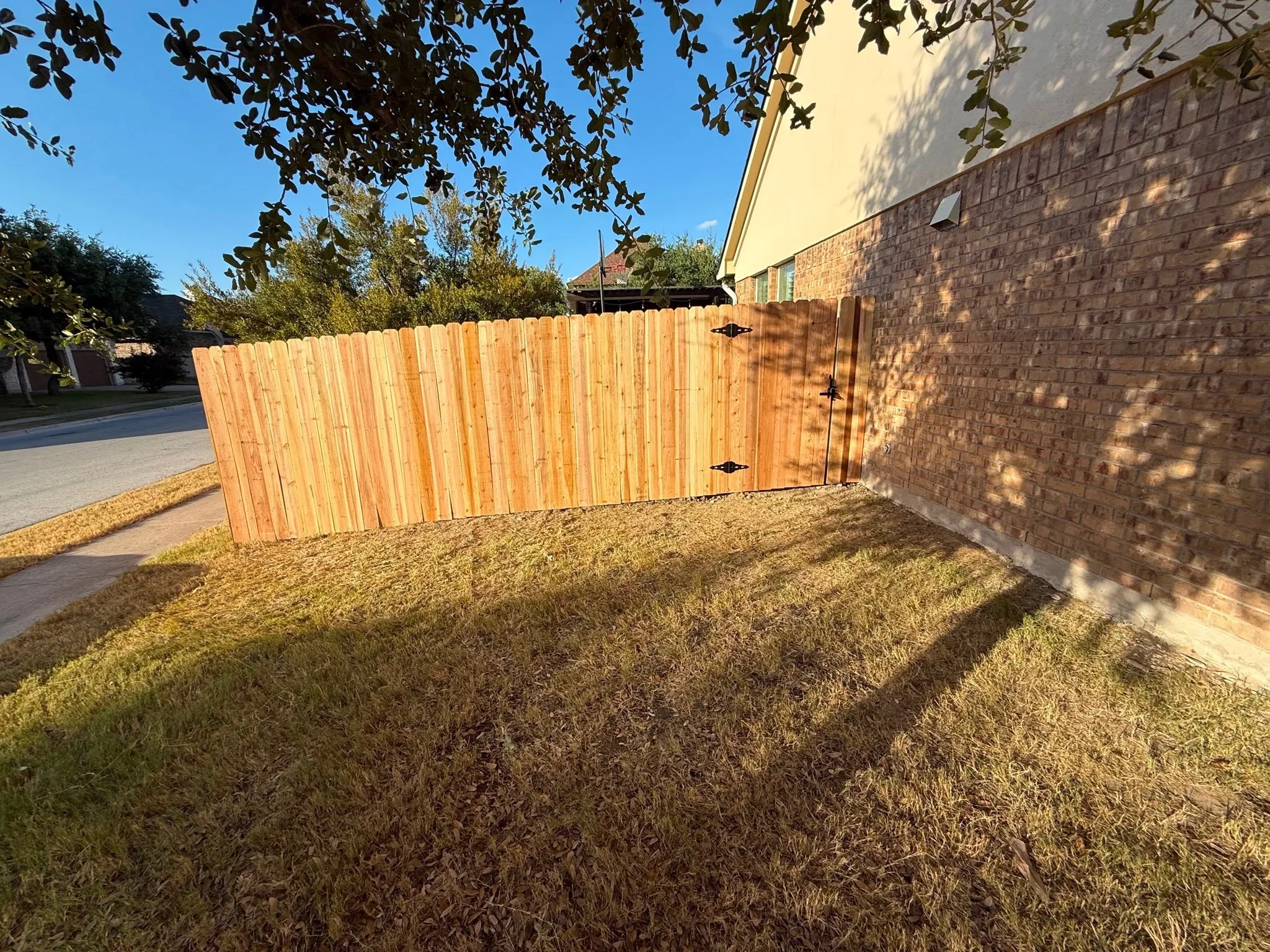 wood stockade fence installed by top rail fence