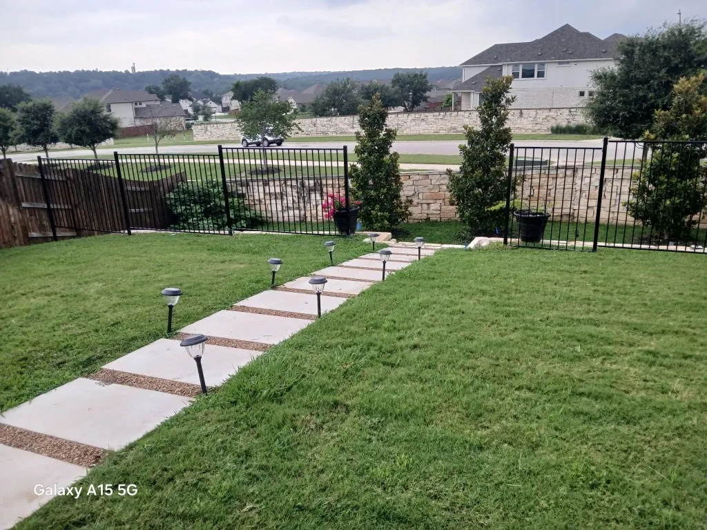 two rail ornamental metal fence installed by top rail fence