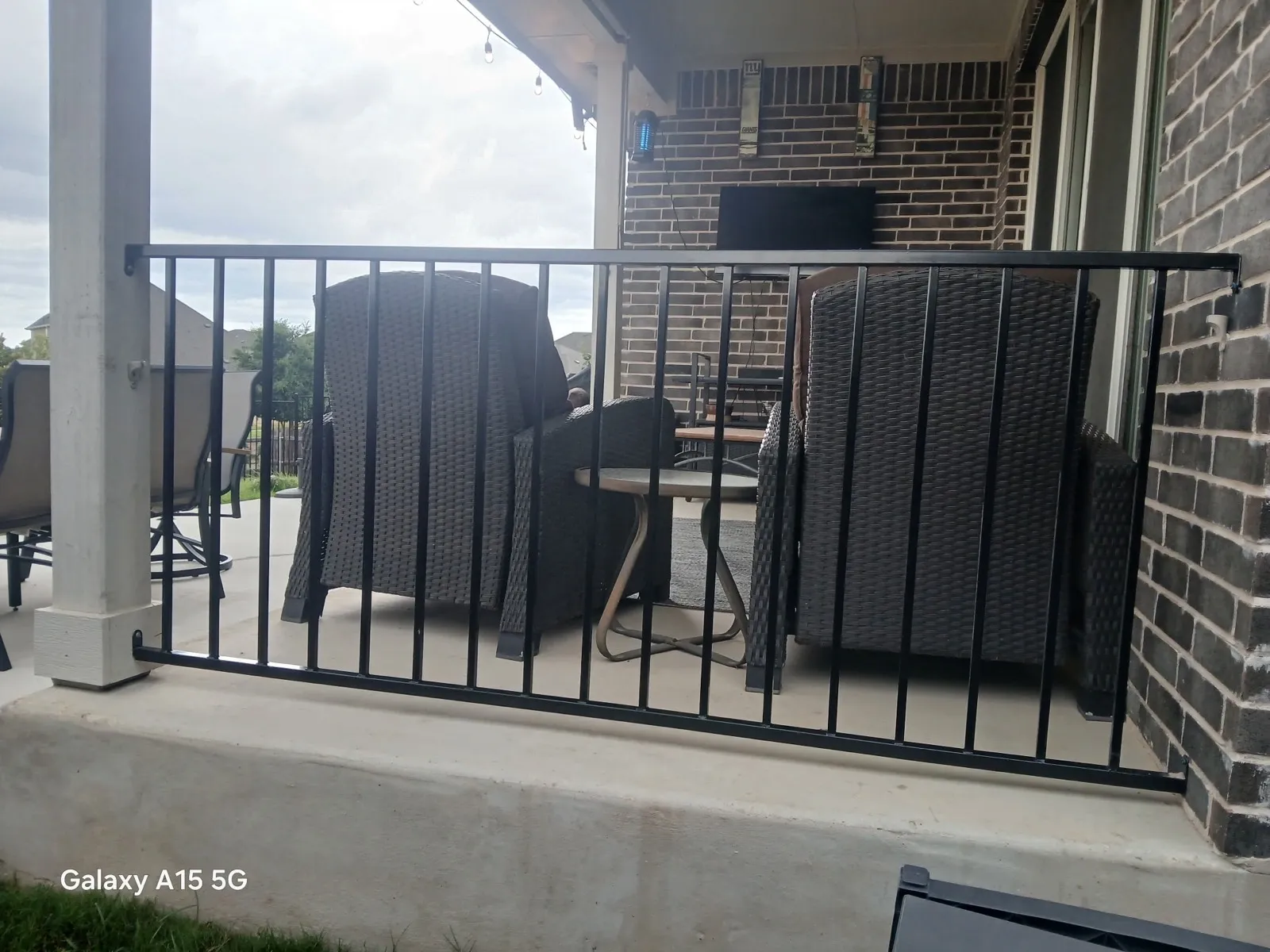 two rail ornamental metal fence installed by top rail fence