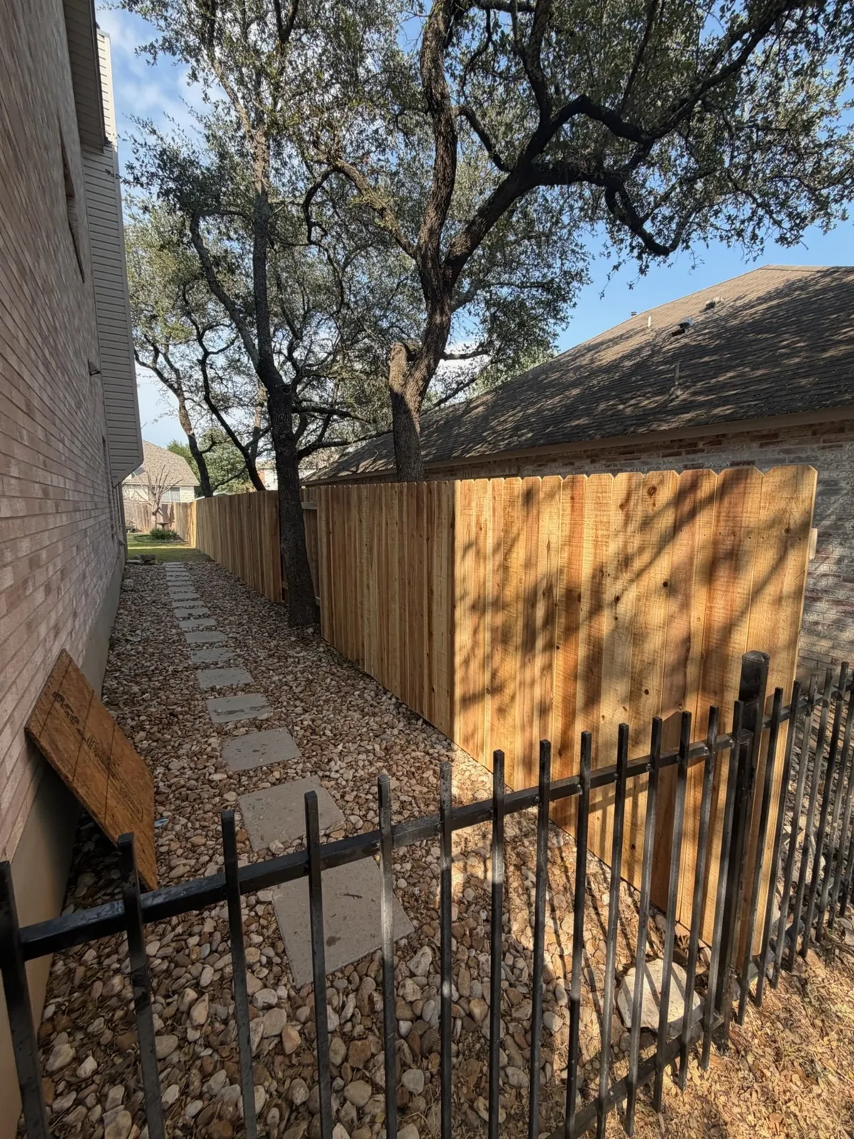 wood stockade fence installed by top rail fence