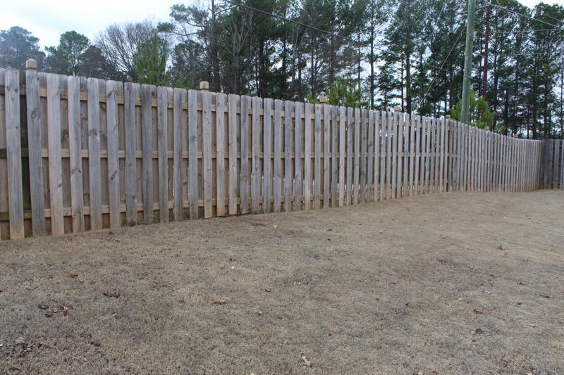 wood shadowbox fence installed by top rail fence