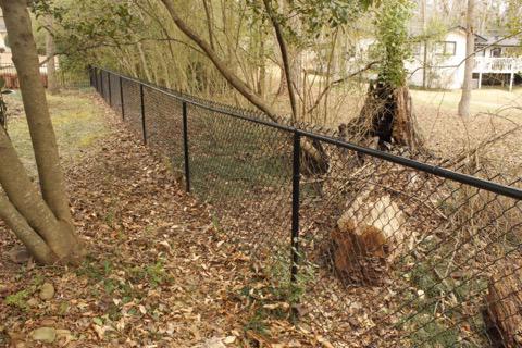 black chain link fence installed by top rail fence