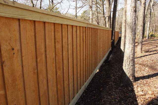 wood board on board fence installed by top rail fence