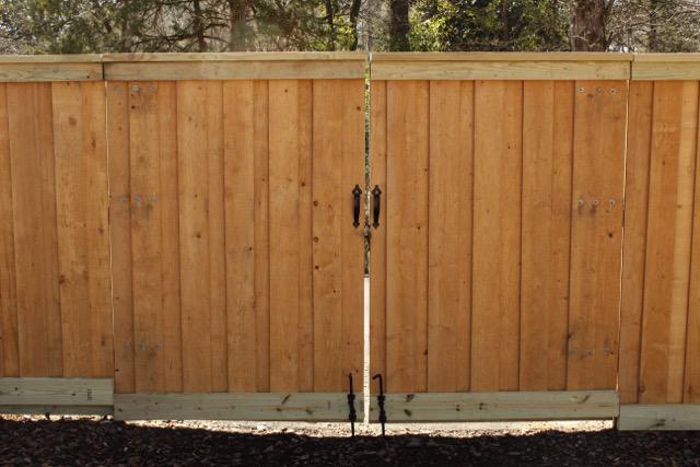 wood board on board fence installed by top rail fence