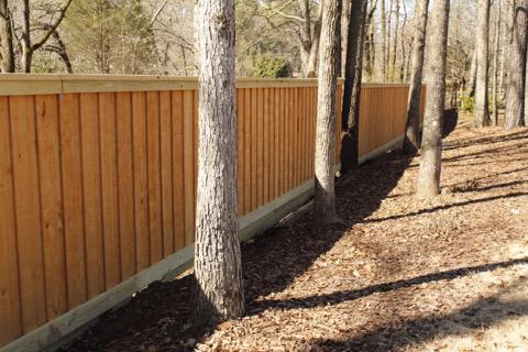wood board on board fence installed by top rail fence