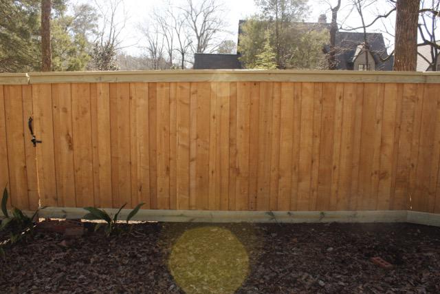 wood board on board fence installed by top rail fence