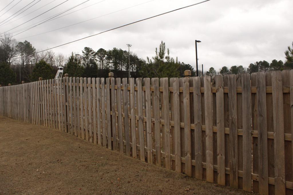 wood shadowbox fence installed by top rail fence