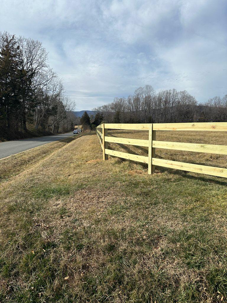 wood ranch rail fence installed by top rail fence