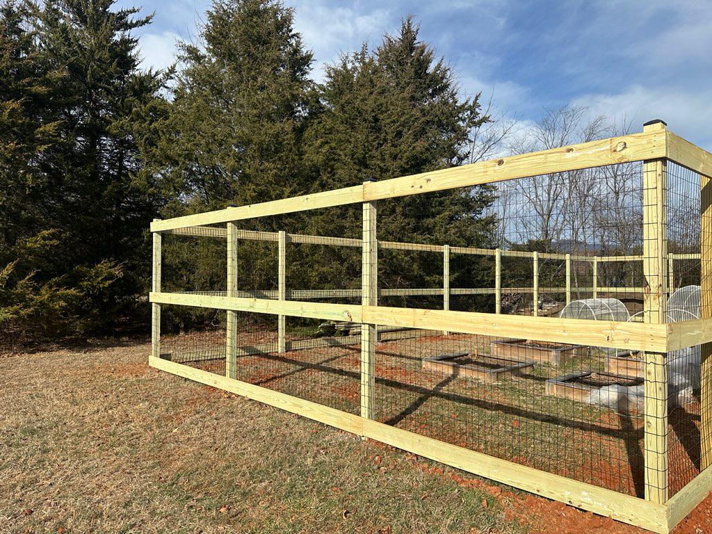 hogwire fence installed by top rail fence